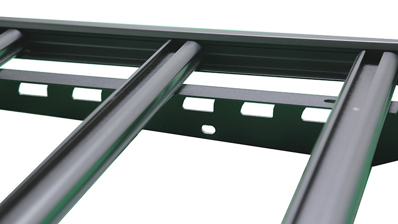 The crossbars are bolted to the frame rails at each end.